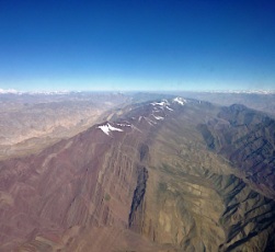 Fig 6 Aerial Photograph of the Himalaya/Karakorum to the northwest of Leh (Ladakh) with the Crystalline Himalaya (snow capped mountains in the distance on the left), the Karakorum (snow capped mountains in the distance on the right),